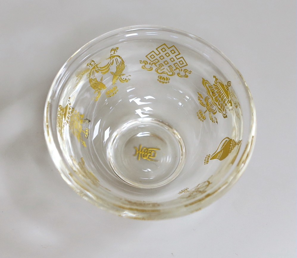 A Tibetan glass gilt decorated 'eight Buddhist emblems' bowl, 9cms diameter